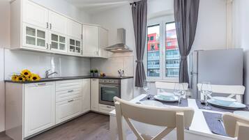 City Apartment, 2 Bedrooms | Private kitchen | Fridge, oven, stovetop, dishwasher