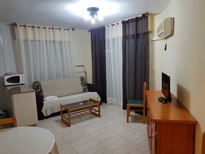 Apartment, 1 Bedroom | Living area | Flat-screen TV - Apartamentos Olympia Center (Cartagena)