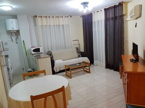 Apartment, 1 Bedroom | Living area | Flat-screen TV - Apartamentos Olympia Center (Cartagena)