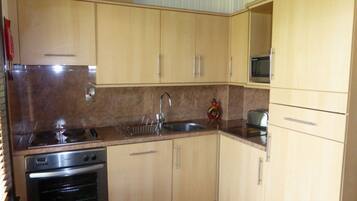 Cabin, Multiple Beds | Private kitchen | Fridge, microwave, oven, stovetop