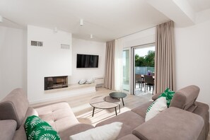 Appartamento, 2 camere da letto (4) | Area soggiorno | TV a schermo piatto