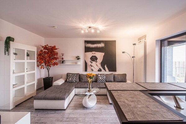 Luxury Apartment, 1 King Bed with Sofa bed, Non Smoking, City View | Living area | 65-inch Smart TV with cable channels, TV, video-game console