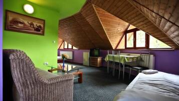 Family Room, Multiple Beds | Living area | Flat-screen TV