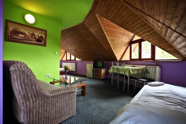 Family Room, Multiple Beds | Living area | Flat-screen TV