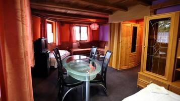 Superior Room, Multiple Beds | Living area | Flat-screen TV