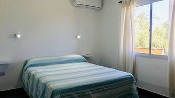 1 bedroom, desk, bed sheets