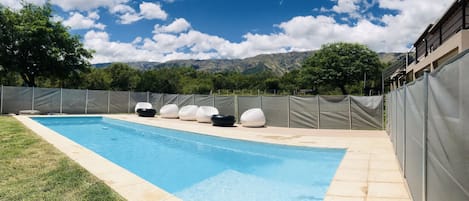Outdoor pool, pool umbrellas, sun loungers