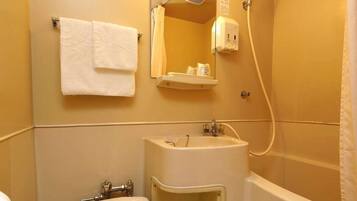 Combined shower/tub, free toiletries, hair dryer, slippers