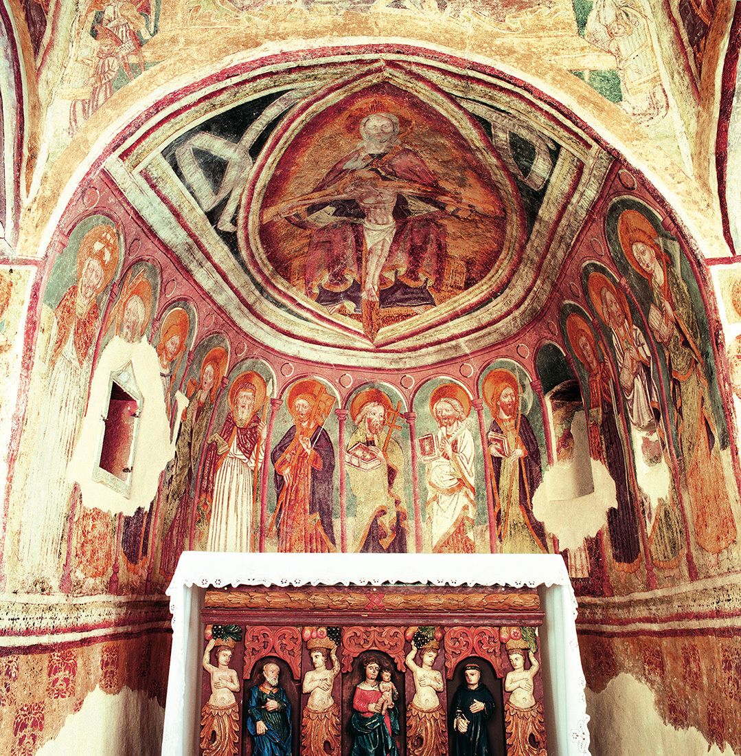 A detailed fresco with religious figures and architectural elements.