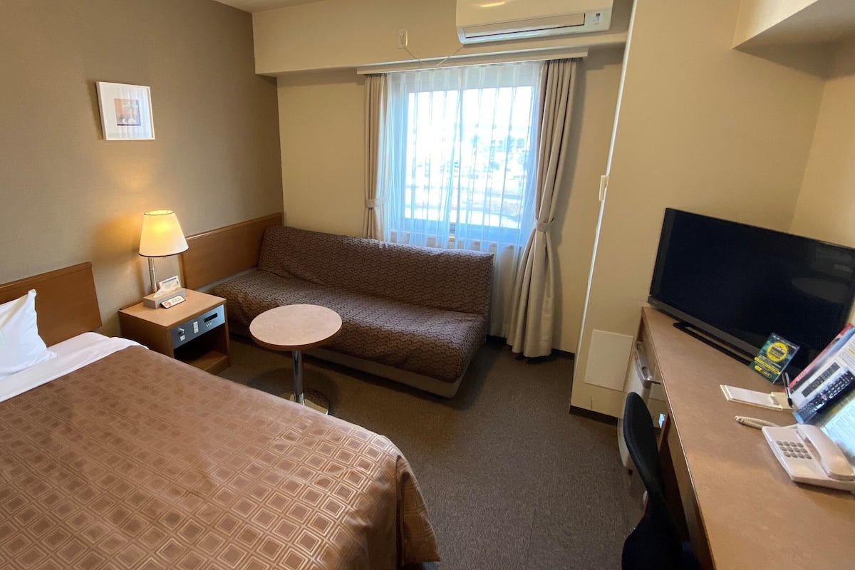 Desk, laptop workspace, blackout curtains, free WiFi