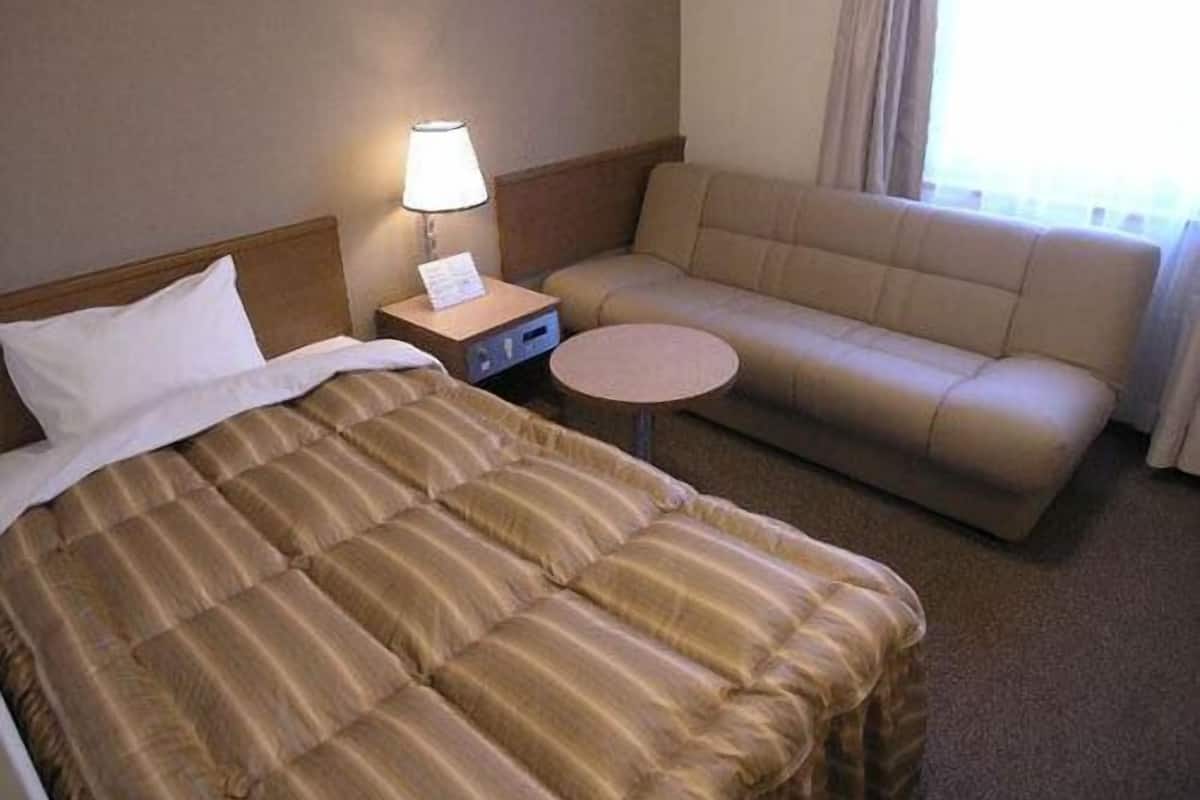 Desk, laptop workspace, blackout curtains, free WiFi