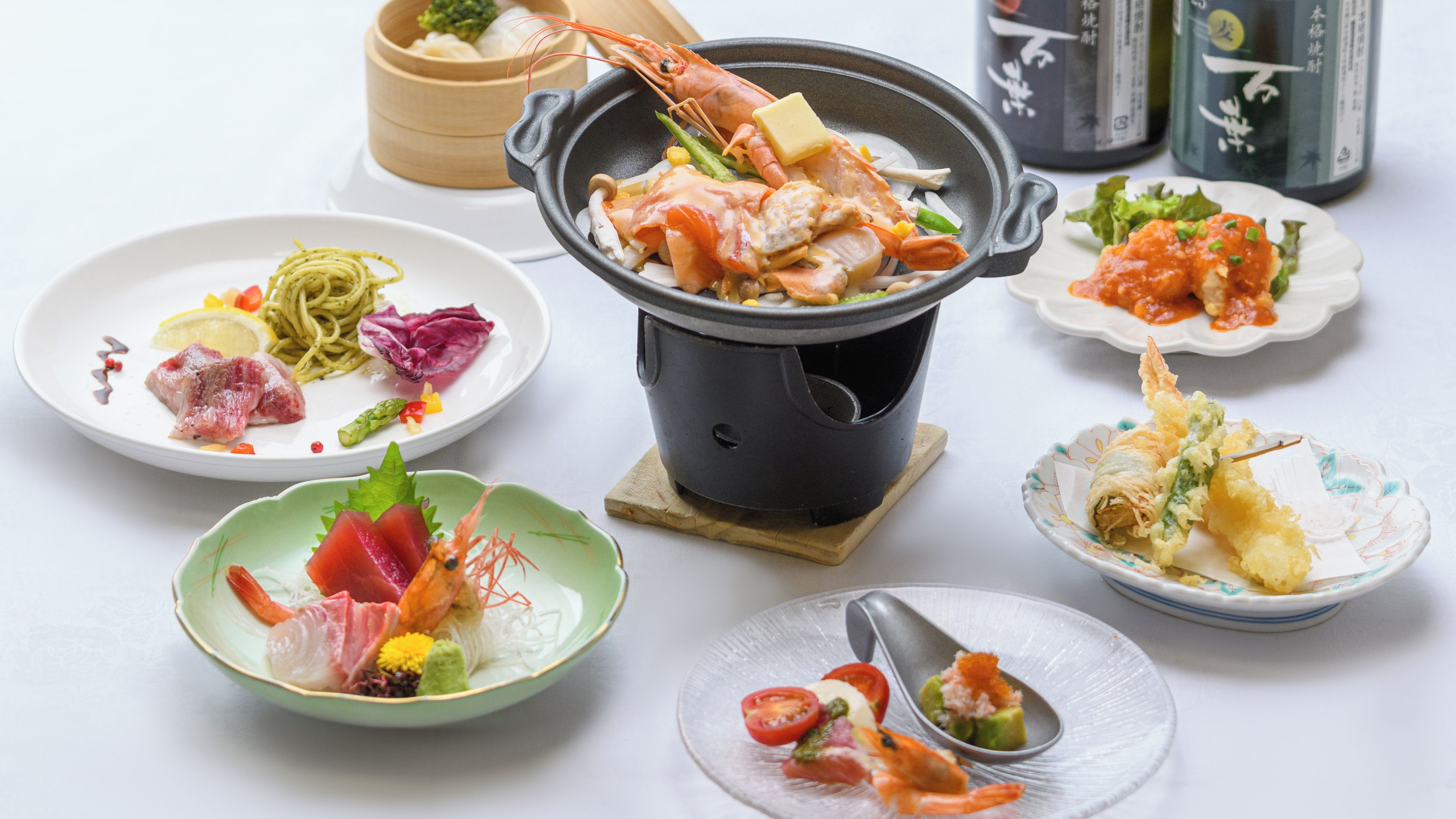 A variety of dishes including seafood, vegetables, and noodles, suggesting a diverse meal selection.