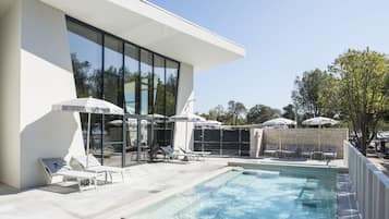 Seasonal outdoor pool, pool umbrellas, pool loungers