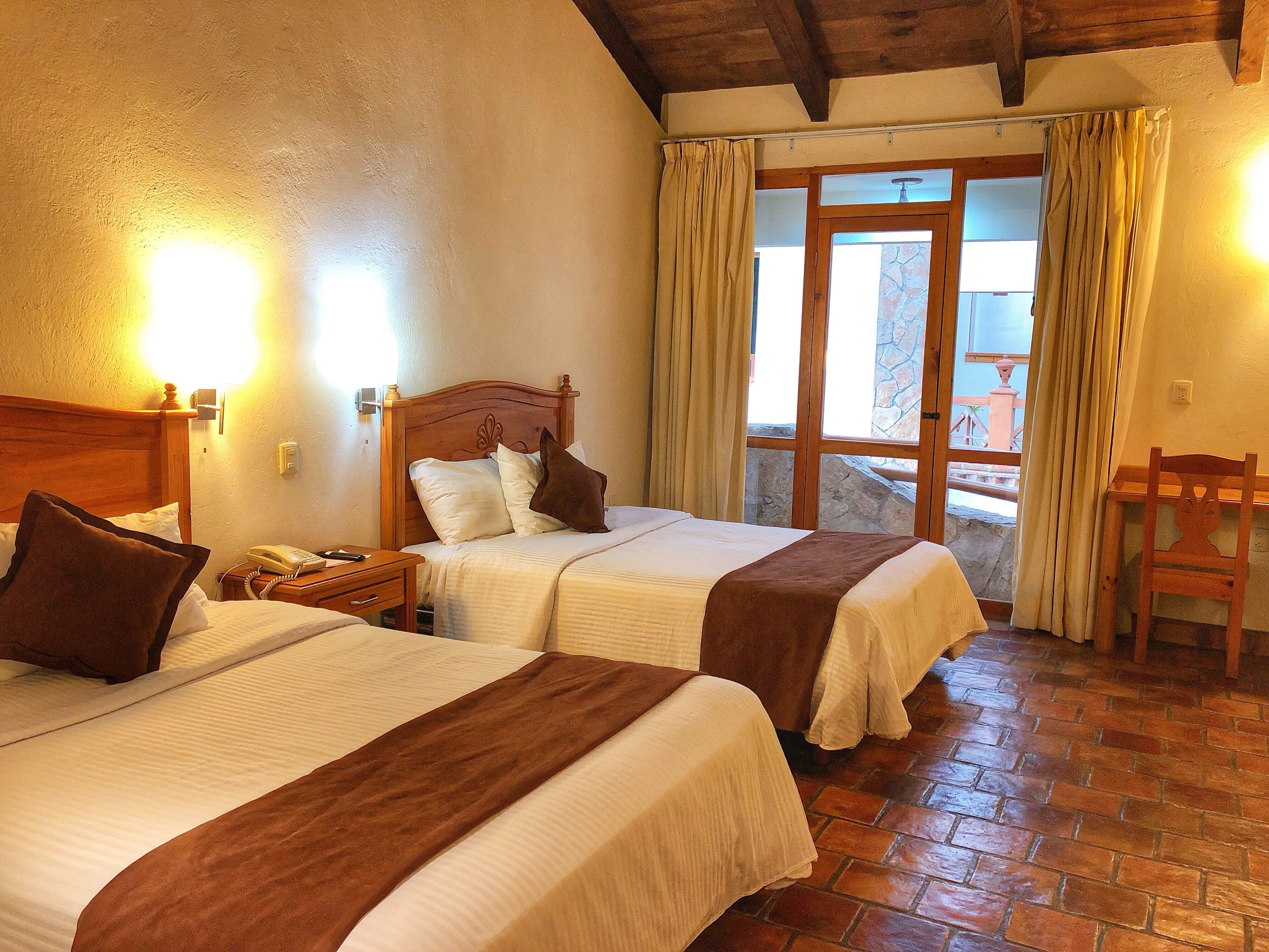 standard double room, 2 double beds | in-room safe, desk, blackout curtains, iron/ironing board