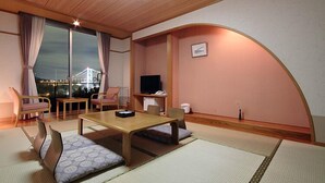A traditional Japanese-style room with tatami flooring, a low table, and seating. - Kokuminshukusha Kaikyo View Shimonoseki (Shimonoseki)