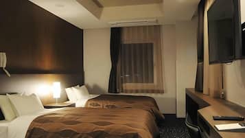 A hotel room with a bed, a desk, a chair, a television, and an air conditioning unit.
