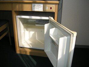 A small, open refrigerator with a control panel on top. - Hotel Elm Regency (Shimizu)