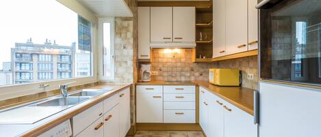 Apartment, 2 Bedrooms (Panisa 401) | Private kitchen | Full-sized fridge, microwave, oven, stovetop