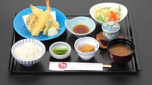 A tray with various Japanese dishes including tempura, rice, and a bowl of soup. - Hotel Heimat (Joetsu)