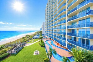 A hotel with a pool, a beach view, and a large building with balconies. - Ashworth #303! 3BR/3BA with Stunning Views & Prime Amenities (North myrtle beach)