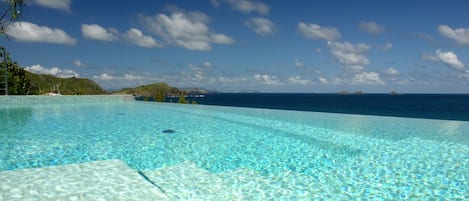 An infinity pool, sun loungers