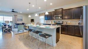 House, Multiple Beds | Private kitchen