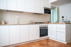 Effortlessly cook and clean in this well-organized kitchen with a dishwasher and ample natural light.