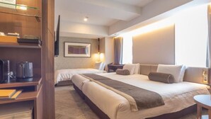 A hotel room with a large bed, a desk with a coffee maker, a bookshelf, and a window with curtains. - The Rise Osaka Kitashinchi (Osaka)