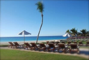 On the beach, sun loungers, beach towels