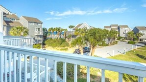 A residential area with houses, a beach, and a clear sky. - Gulf Views · Steps to Beach & Beachfront Pool (Port St. Joe)