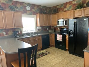 Enjoy cooking in this well-equipped kitchen with a microwave and toaster oven.