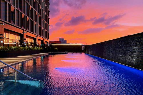 Seasonal outdoor pool, open 10:00 AM to 6:00 PM, pool umbrellas