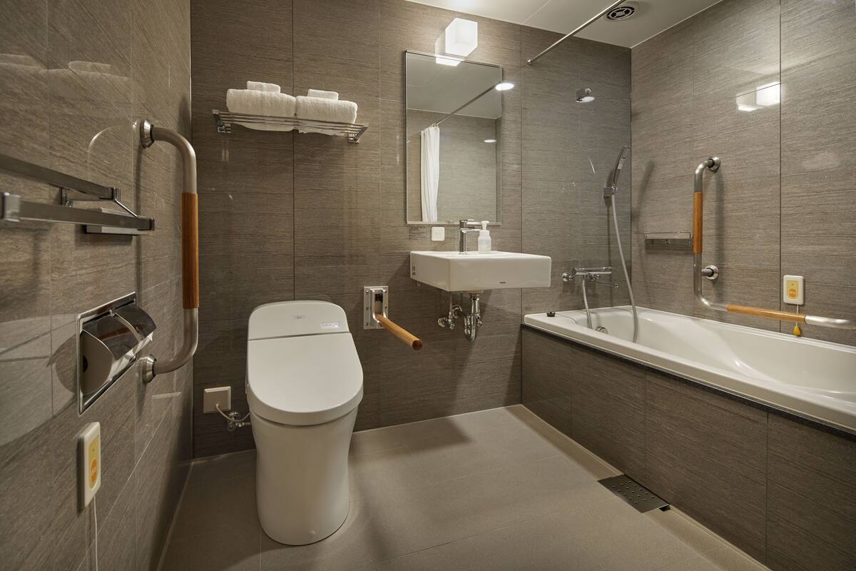basic double room | bathroom | hair dryer, slippers, bidet, towels