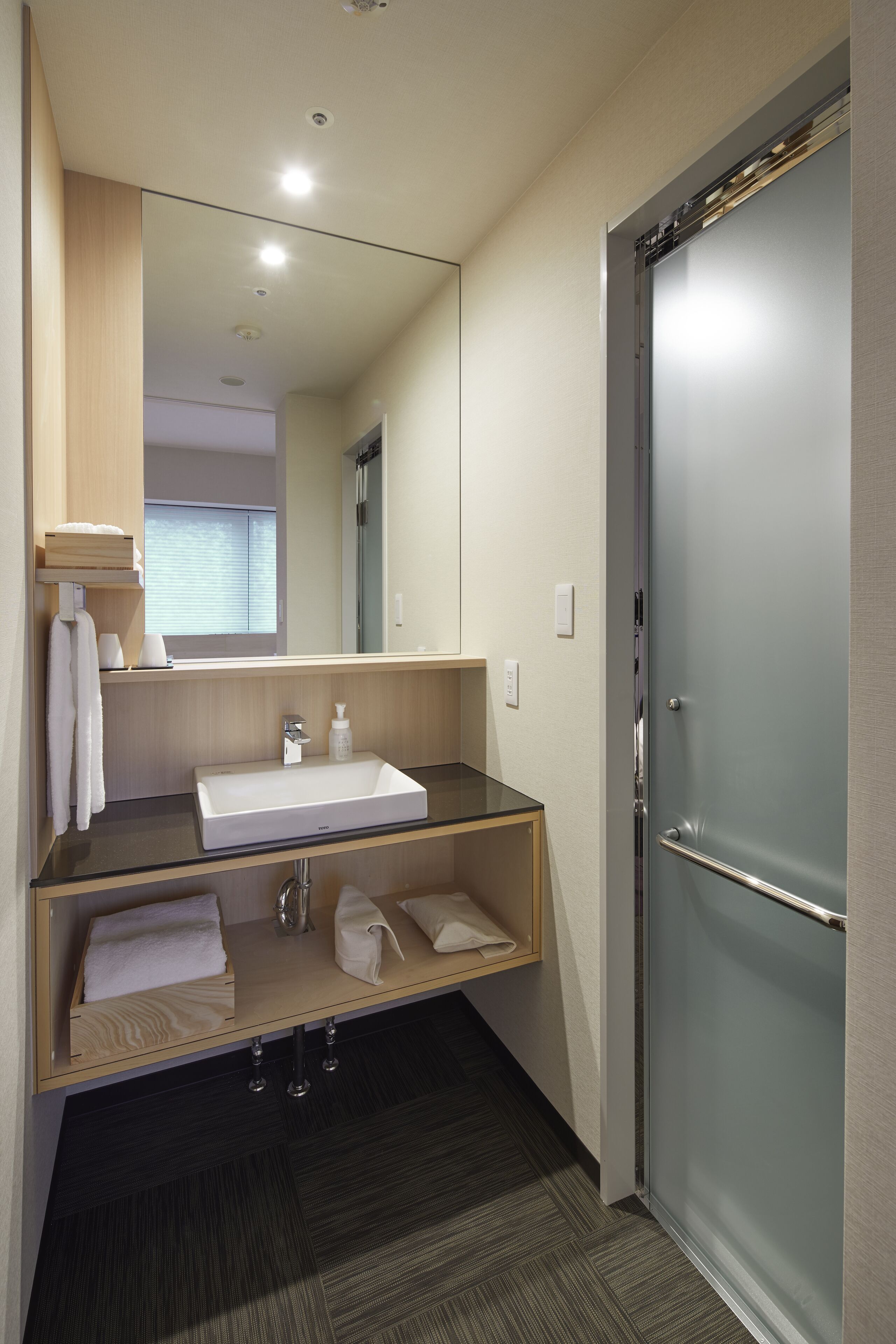 hair dryer, slippers, bidet, towels