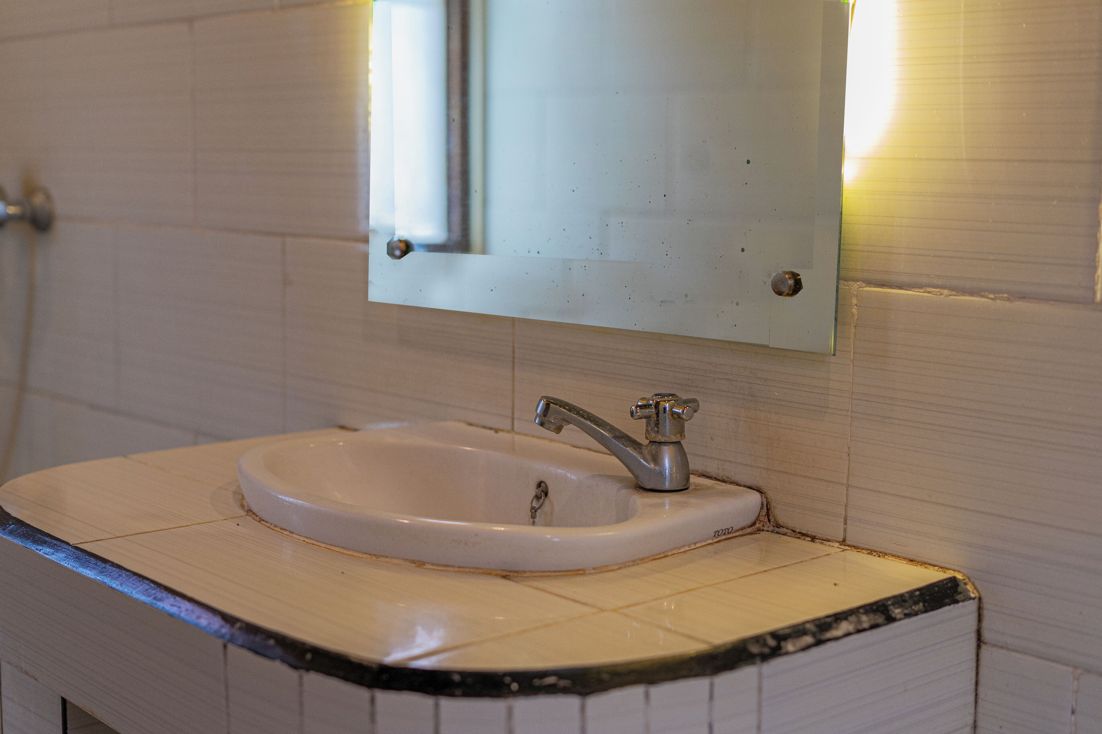 A bathroom sink with a mirror above it.