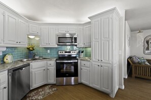 Enjoy cooking in this well-equipped kitchen with a dishwasher, microwave, and oven.