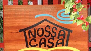 A wooden sign with the text "NOSSA CASA" and "Em Jeri" indicating a personal or private space. - Our House in Jeri 1 (Jijoca de Jericoacoara)
