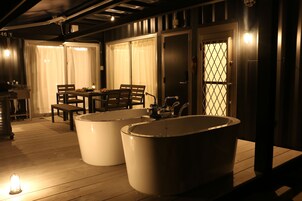 Shower, hair dryer, slippers, towels