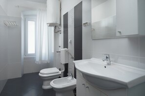 Comfort Apartment, City View | Bathroom | Shower, free toiletries, hair dryer, slippers - Apartments Antons (Pula)