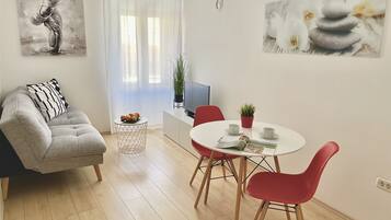 Standard Apartment, 1 Bedroom | Living area | 81-cm LED TV with satellite channels, TV