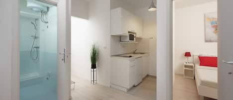 Standard Apartment, Garden View | Private kitchen | Fridge, microwave, stovetop, coffee/tea maker