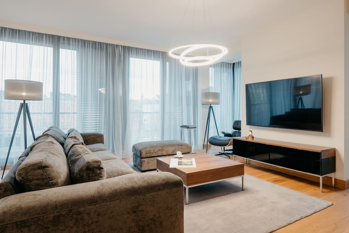 Suite presidencial, 2 habitaciones, vista al río | Área de sala de estar | Televisión de pantalla plana y piso con calefacción