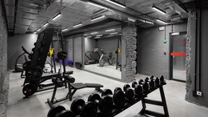 A gym with weightlifting equipment, treadmills, and exercise machines. - Campus Community A-Hotel (Kyiv)