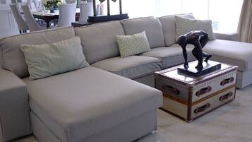 Luxury Penthouse, City View | Living area | TV