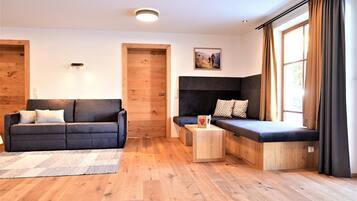 Luxury Apartment, 2 Bedrooms, Sauna, Garden View (Grubigstein) | Living area | 100-cm flat-screen TV with satellite channels, TV, ping pong