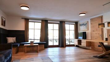 Luxury Apartment, 2 Bedrooms, Sauna, Garden View (Grubigstein) | Living area | 100-cm flat-screen TV with satellite channels, TV, table tennis