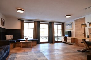 Luxury Apartment, 2 Bedrooms, Sauna, Garden View (Grubigstein) | Living area | 100-cm flat-screen TV with satellite channels, TV, table tennis