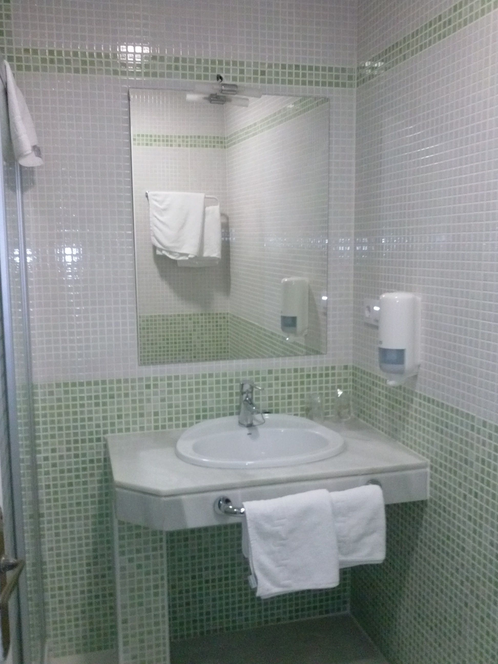 deep-soaking bathtub, bidet, towels, soap