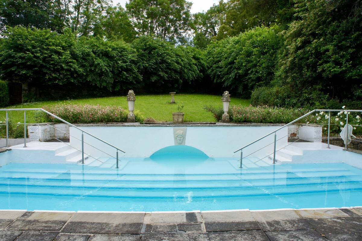 outdoor pool, pool umbrellas, pool loungers