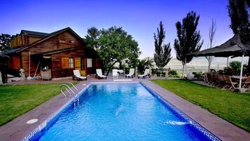 Indoor pool, outdoor pool, pool umbrellas, sun loungers